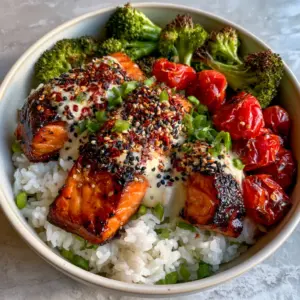 Close-up macro shot of seared honey-garlic salmon with crispy edges and moist orange flakes. (healthy dinner ideas)